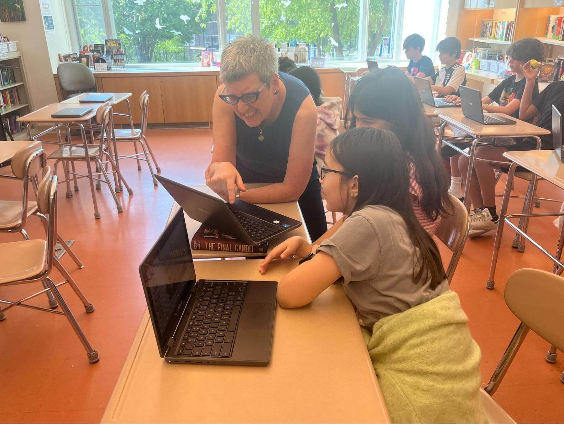 Ethical Culture Fieldston School 7th Graders work on their capstone project with their teacher.