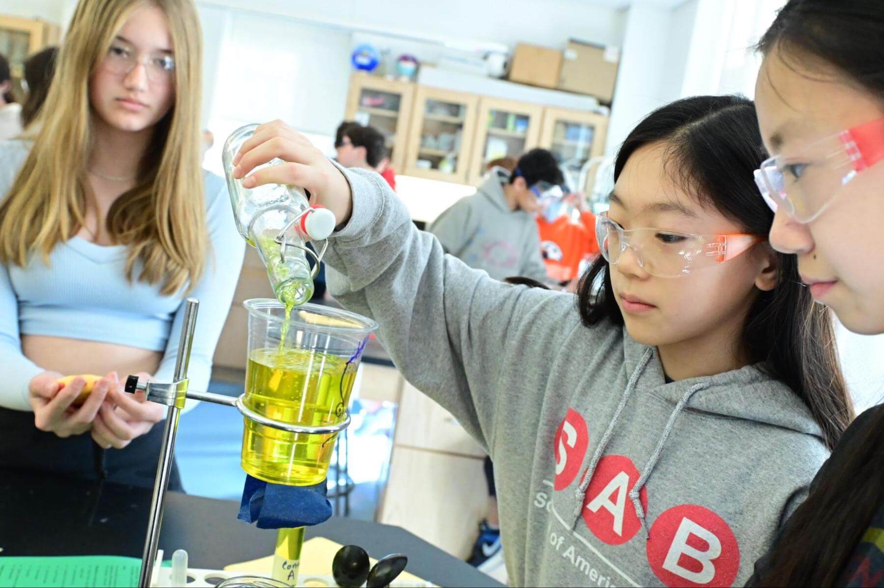 7th Grade students at Ethical Culture Fieldsotn School perform a science experiment.