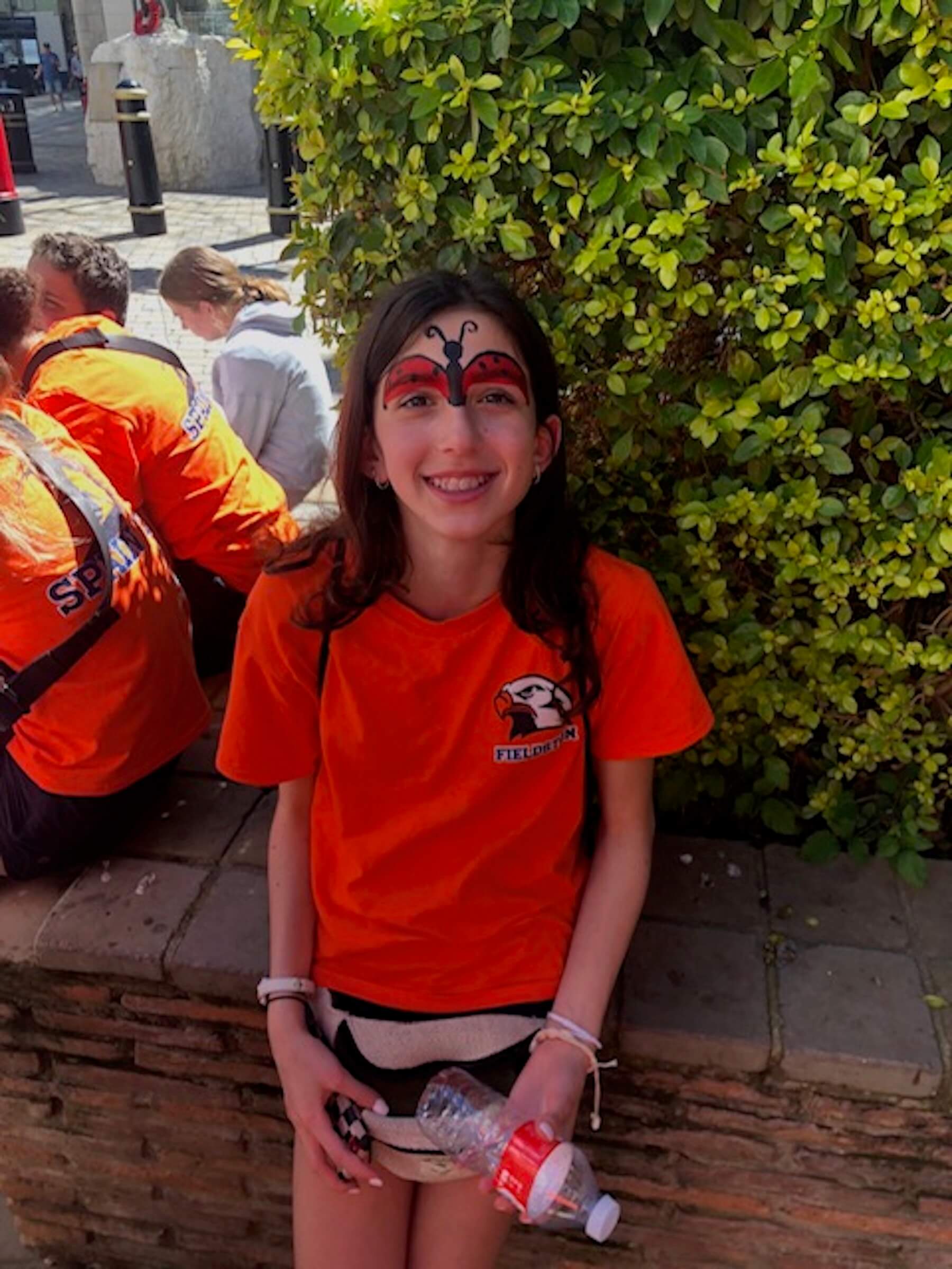 An Ethical Culture Fieldston Middle School student gets her face painted in Spain