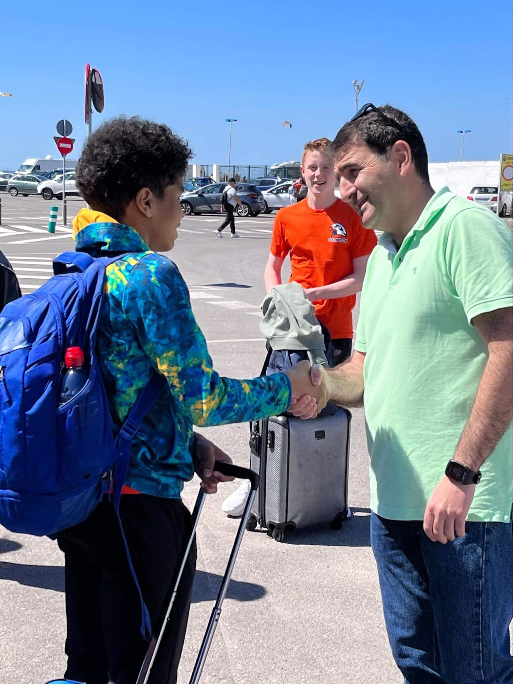 An Ethical Culture Fieldston Middle School student meets his homestay family in Spain