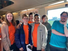 A group of Ethical Culture Fieldston Middle School students ride a train in Spain