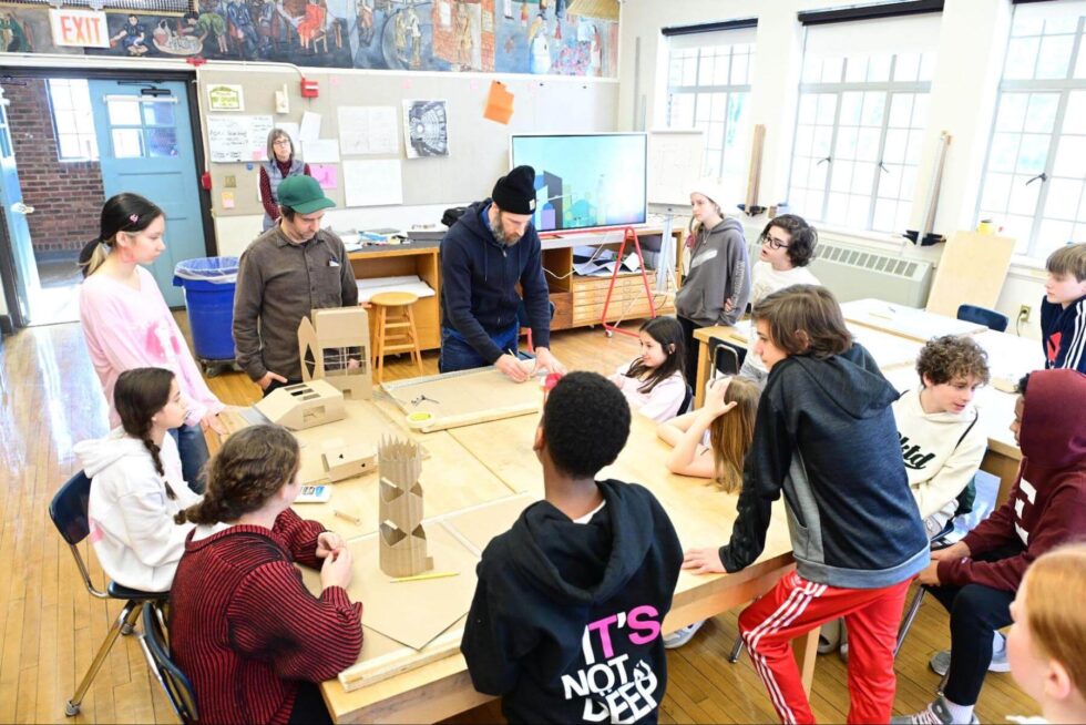 A group of Fieldston Middle students participate in model building class.