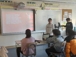 Two Ethical Culture Fieldston 6th Grade students present their math project to the class.