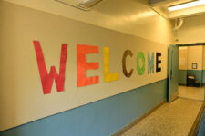Large cut out paper letters spell out 