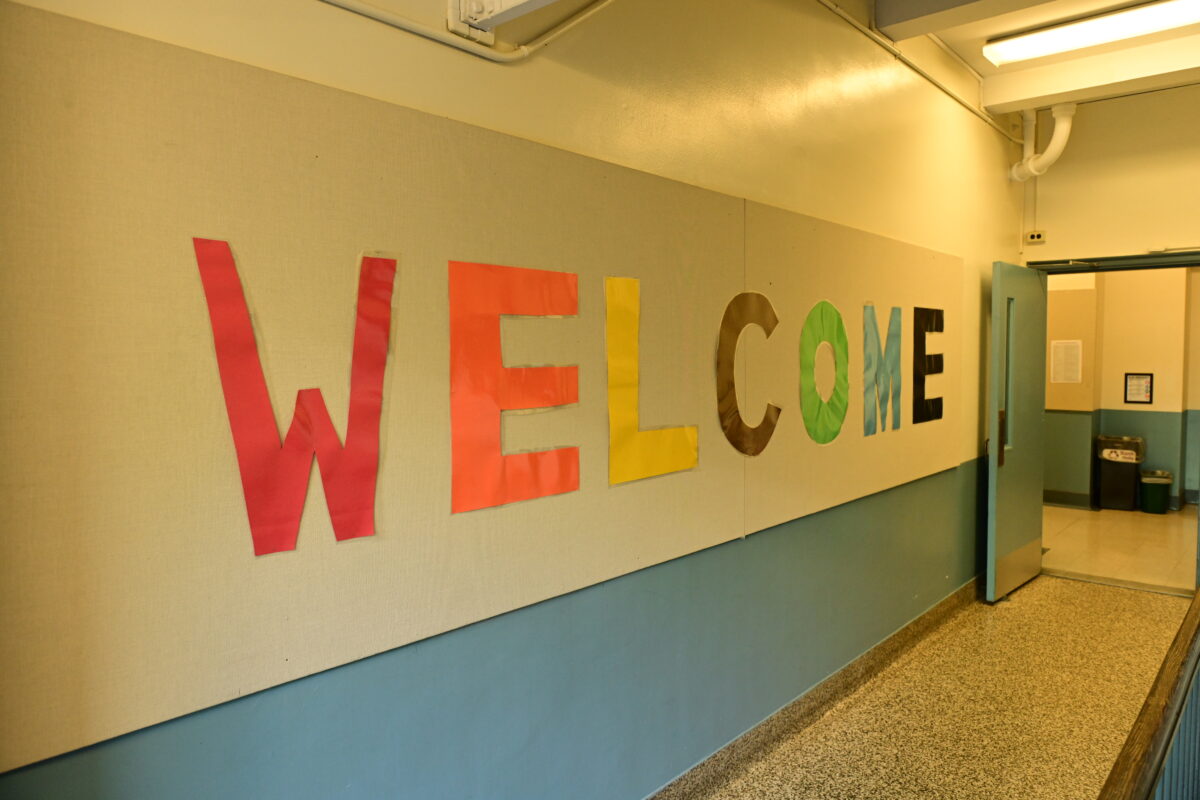 Large cut out paper letters spell out "Welcome" on the walls of Fieldston Lower
