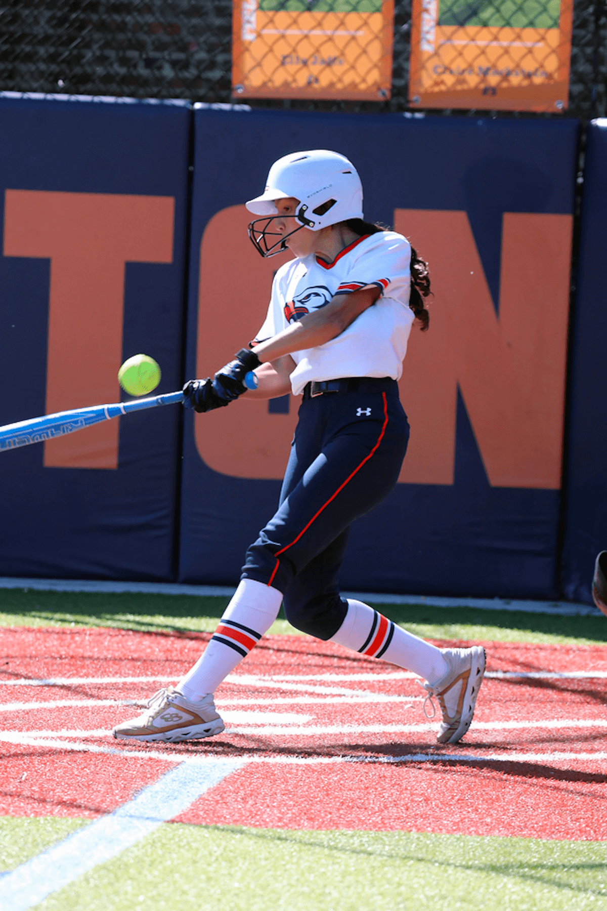 An Ethical Culture Fieldsotn softball player plays at Spring Fling.