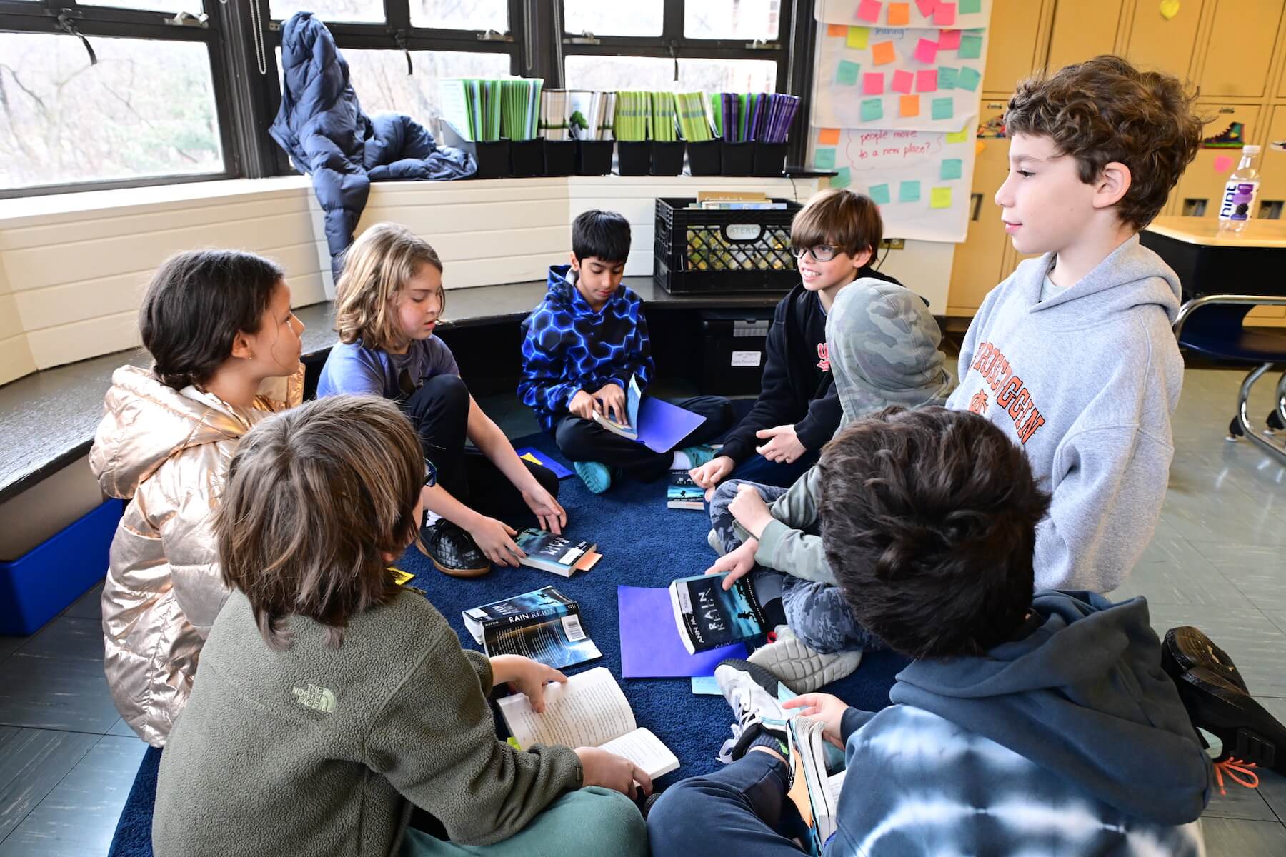 Ethical Culture Fieldston School Fieldston Lower 4th graders sitting in circle discussion during book club unit