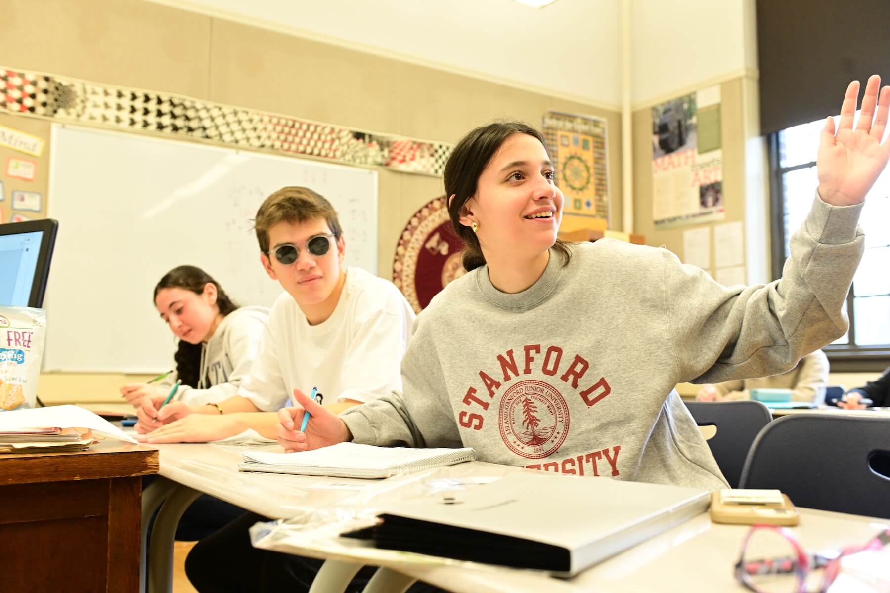 Ethical Culture Fieldston School Fieldston Fieldston Upper student sitting at desk raises hand during math class