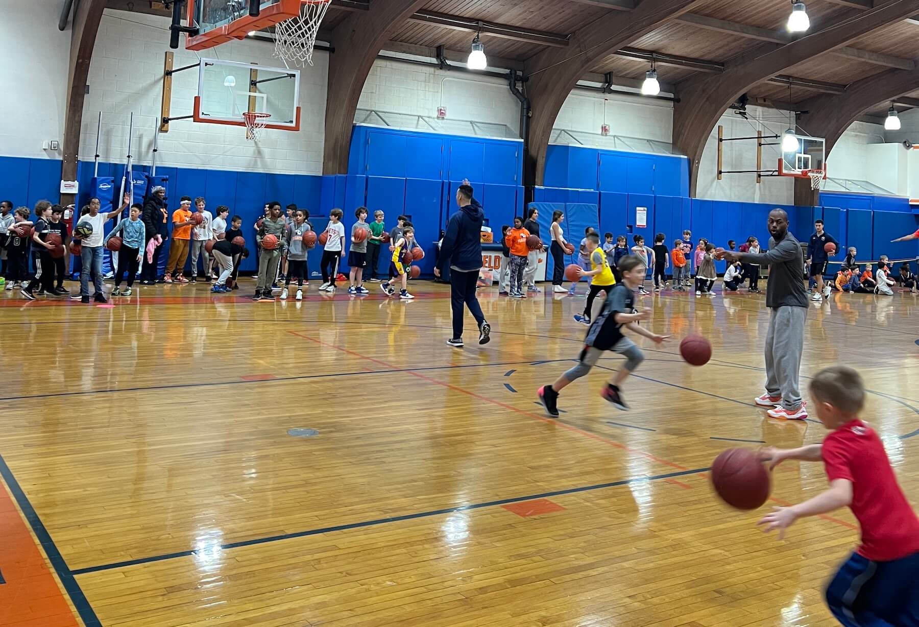 Ethical Culture Fieldston School Fieldston students play basketball in gym during March Madness event