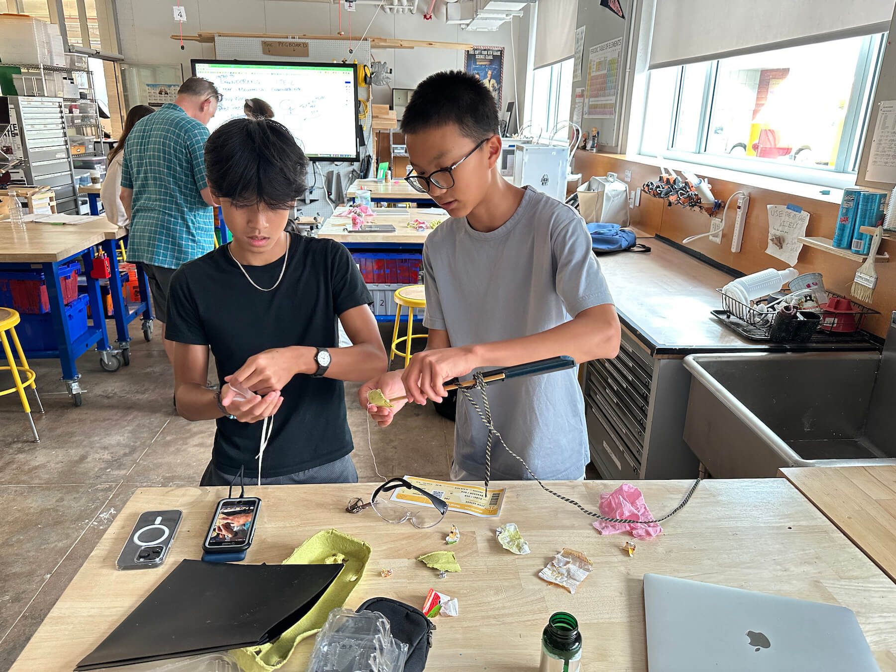 Two Ethical Culture Fieldston School students take an engineering class.