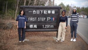 Three Ethical Culture Fieldston Upper School students pose at Mount Fuji in Japan