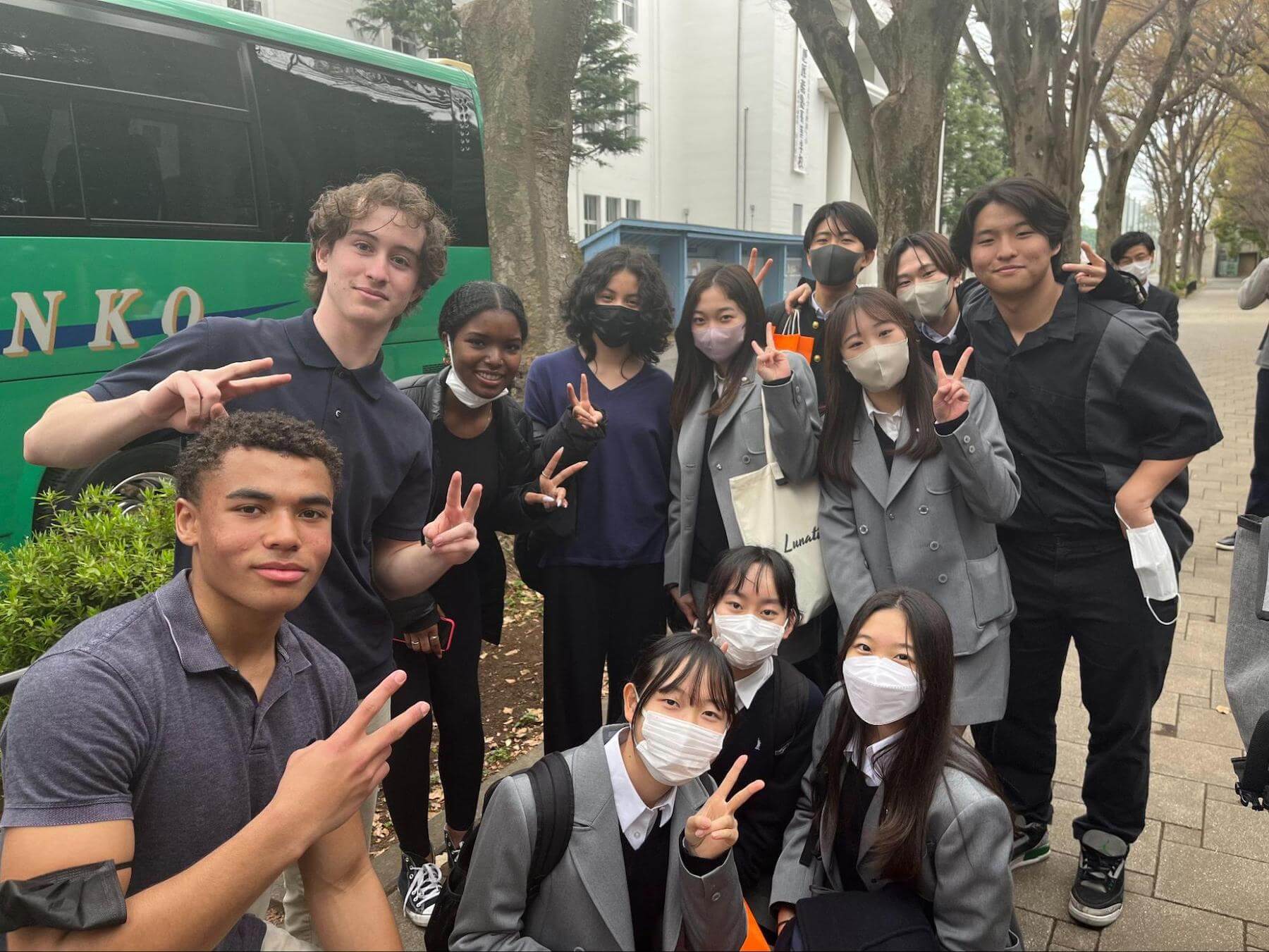 Ethical Culture Fieldston Upper School students pose with Japanese students on their spring break trip