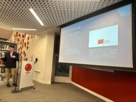 An Ethical Culture Fieldston School student speaks at science research event.