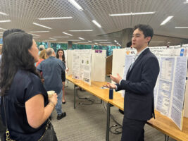 An Ethical Culture Fieldston School student speaks at science research event.