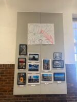 Photo of CitySem photography board. The board contains several printed photographs taken by students.