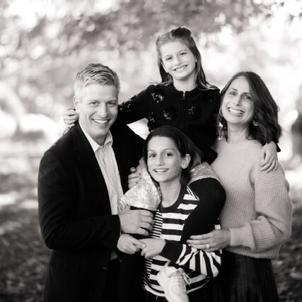 Ethical Culture Fieldston School student Wyatt G. ’29 poses with his mother, father, and younger sister.