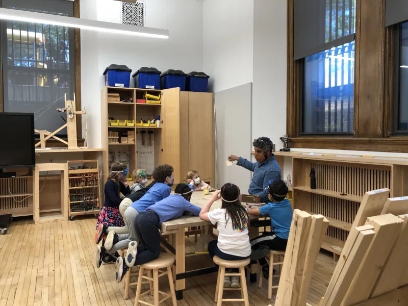 Students gather together in Woodshop class