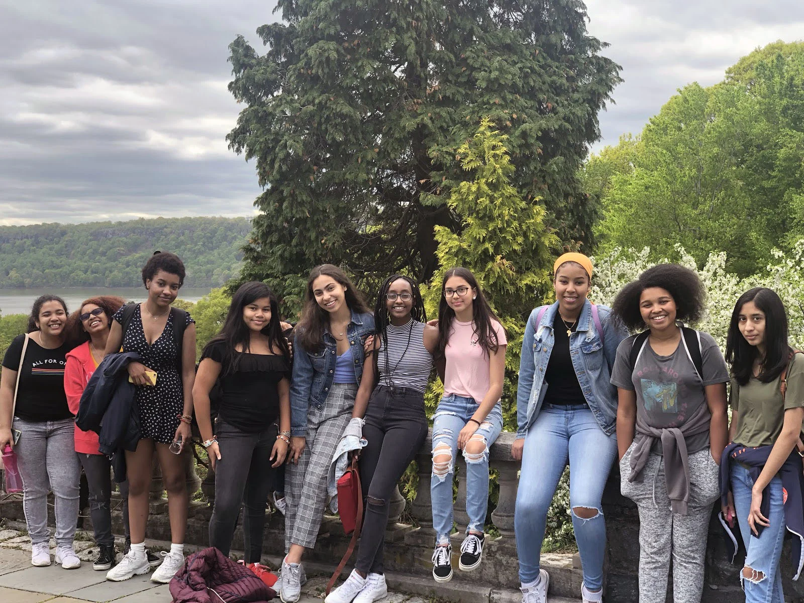 The Womyn of Color Collective Retreat at Wave Hill gathers for a picture.