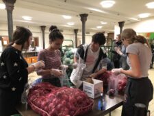 Students sort through food at pantry