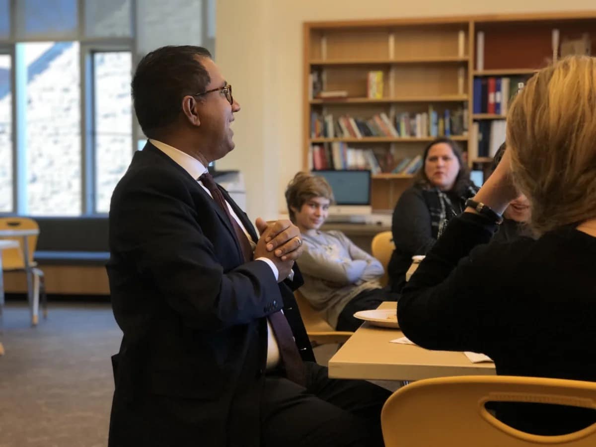 Rashid answers questions from students over lunch