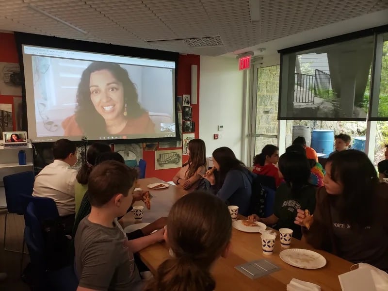 Students watch Nezhukumatathil speak on screen in classroom