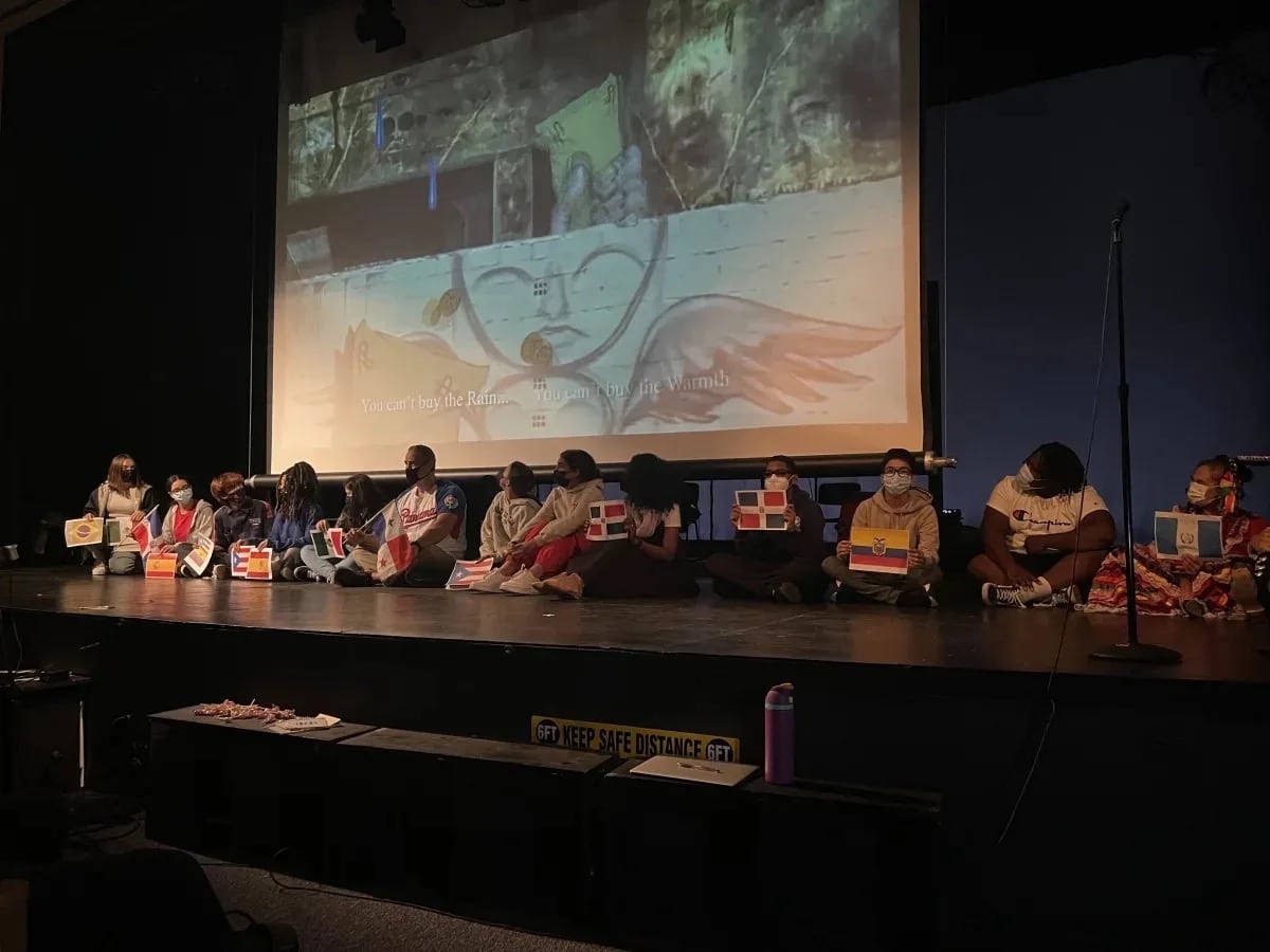 Students participate in Latinx Heritage Month assembly on auditorium stage