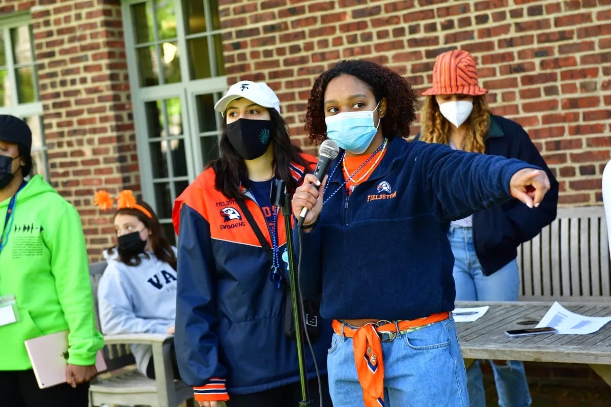 Students speak on microphone