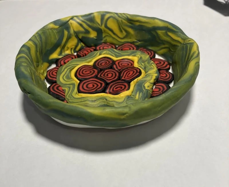 photo of green and red ceramic art bowl