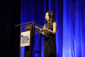 Student gives speech at podium