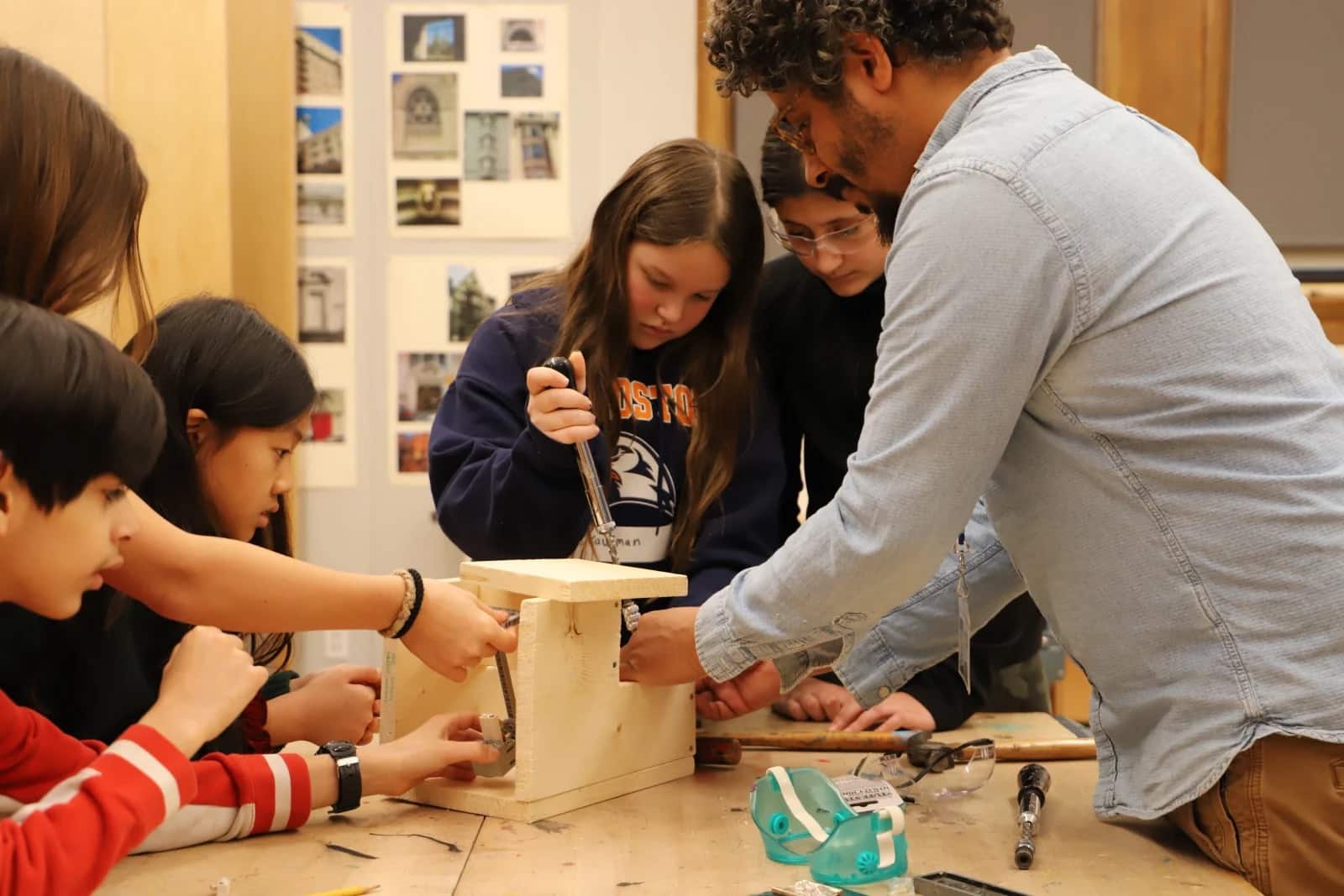 Students work on climate action project with teacher Leonard White