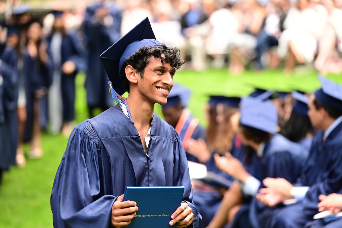 ecfs commencement student receiving diploma