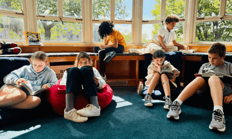 Ethical Culture Fieldston School 5th Graders read in the library.