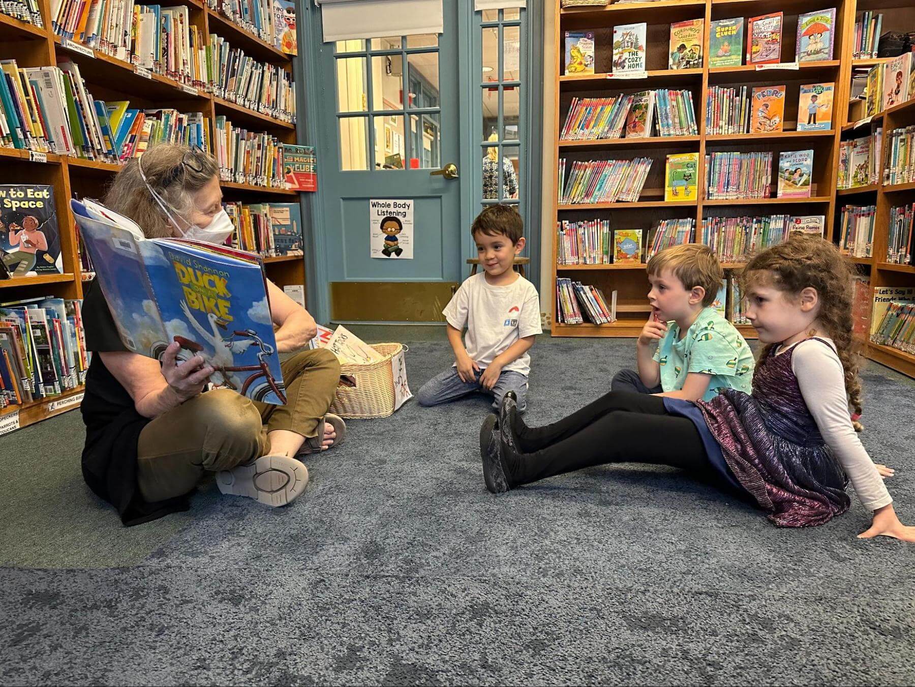 Ethical Culture Fieldston School Pre-K students read in the library.