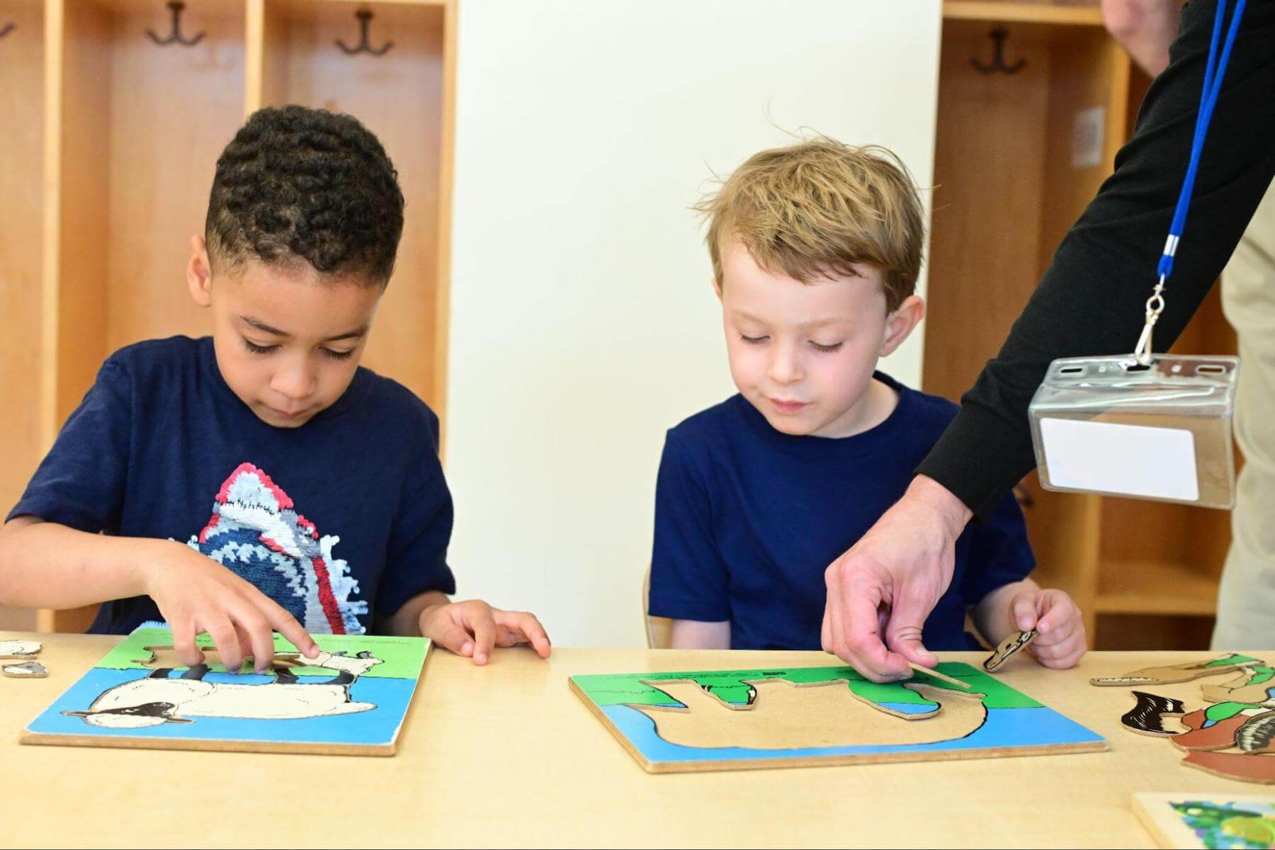 Ethical Culture Fieldston School Fieldston Lower students play a puzzle.
