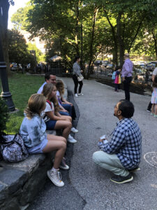 Ethical Culture Fieldston School's Shawn Chisty kneels down next to new Fieldston Lower students on the first day of school.