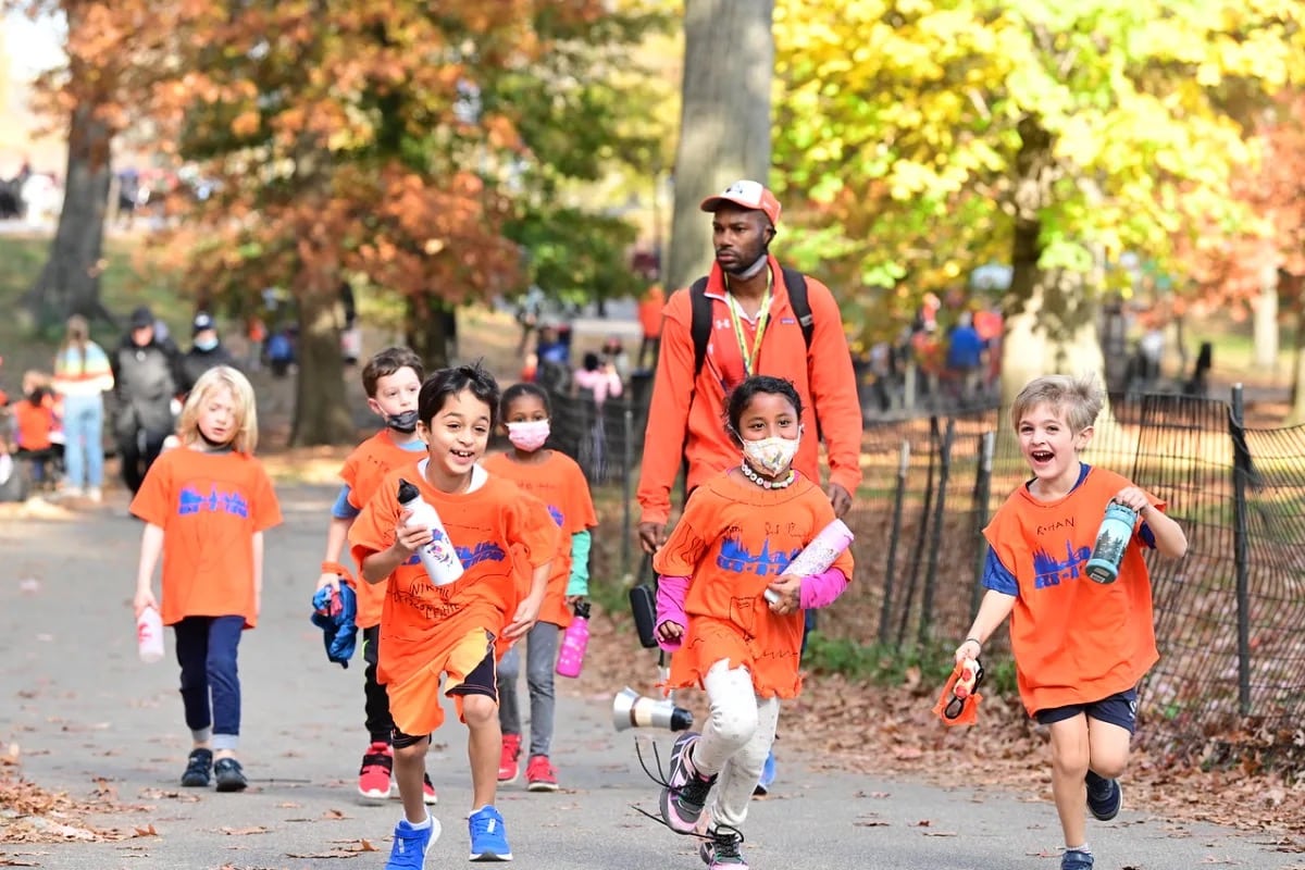 Students run together in Central Park