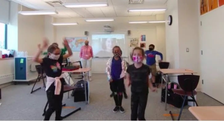 Students dance in classroom